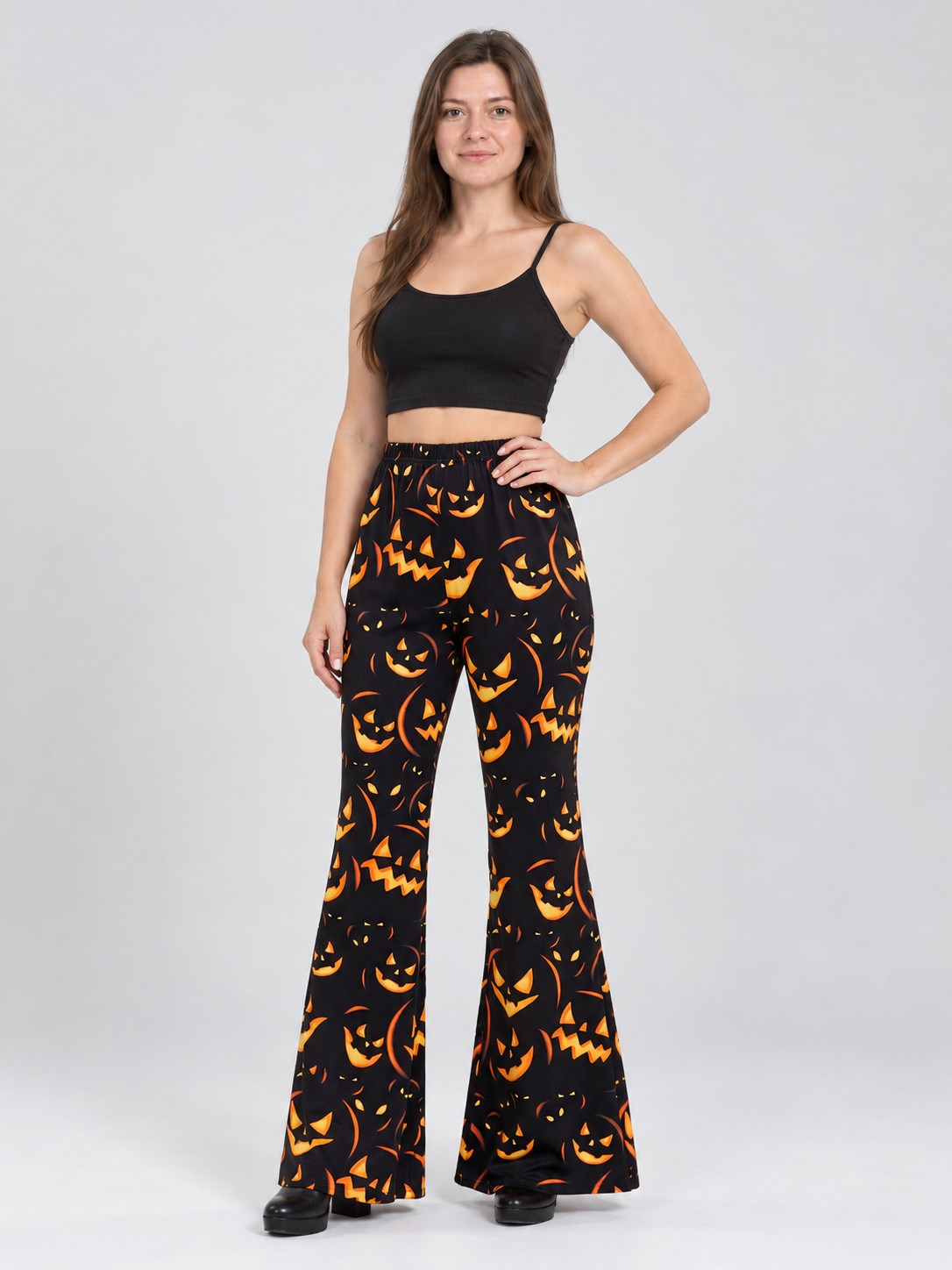 Black Flared Carnival Pants with Orange Smiling Pumpkin Print