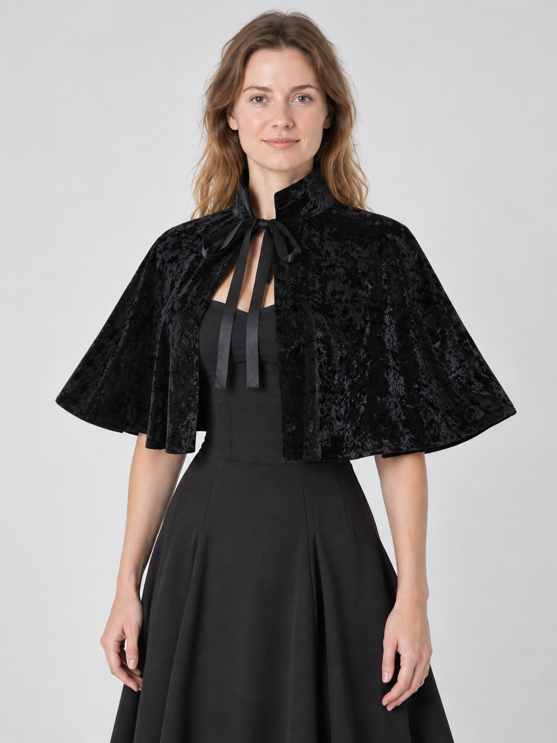 Black velvet cape with high collar and ties
