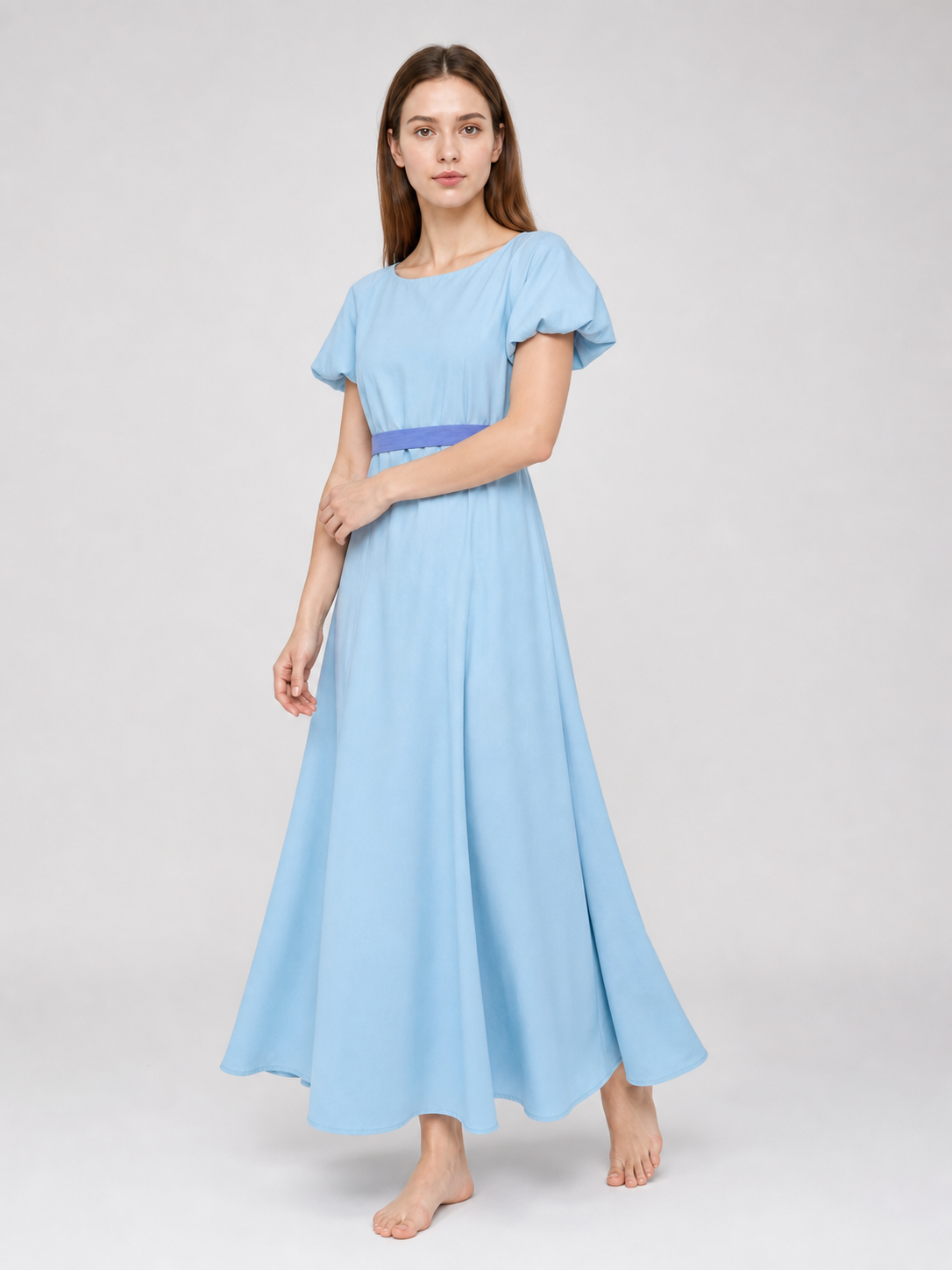 Peter Pan cosplay dress in light blue with contrasting purple-blue details. This style features a round neckline, short sleeves, and a long silhouette with a fitted upper body and a flared A-line skirt. The waist has contrasting ties that a