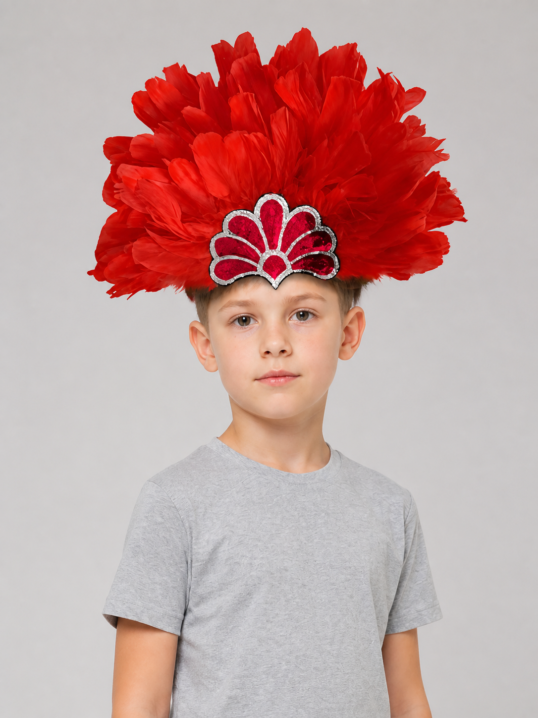 Red feather headband with a silver-trimmed fan decoration, displayed front-facing against a white background