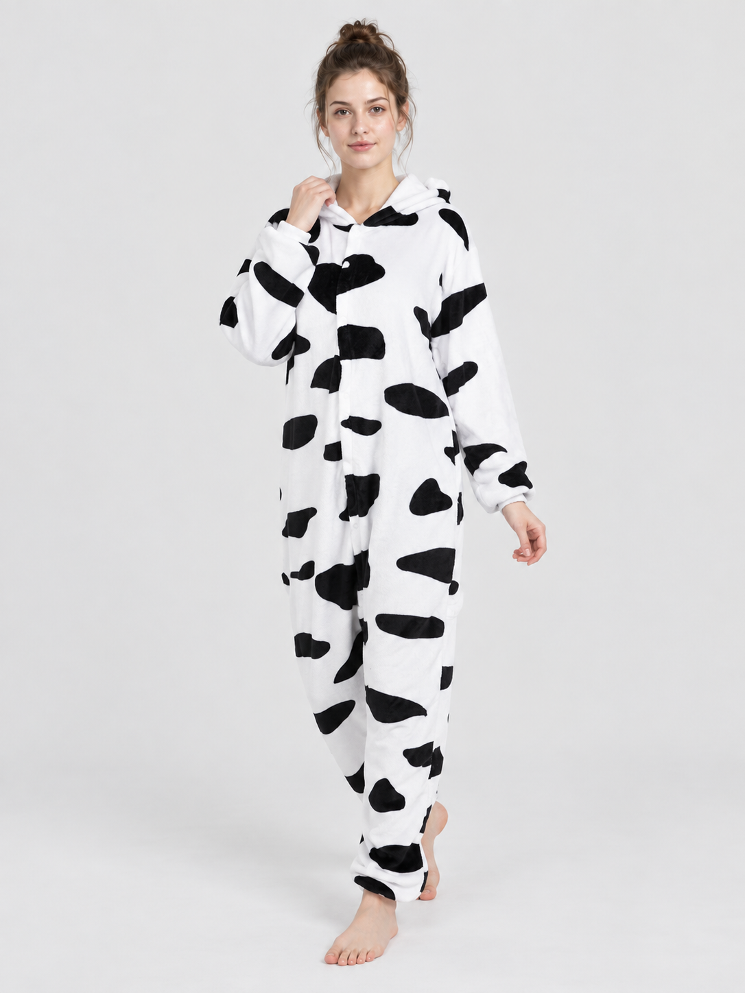White pajama jumpsuit with black spots and a hood