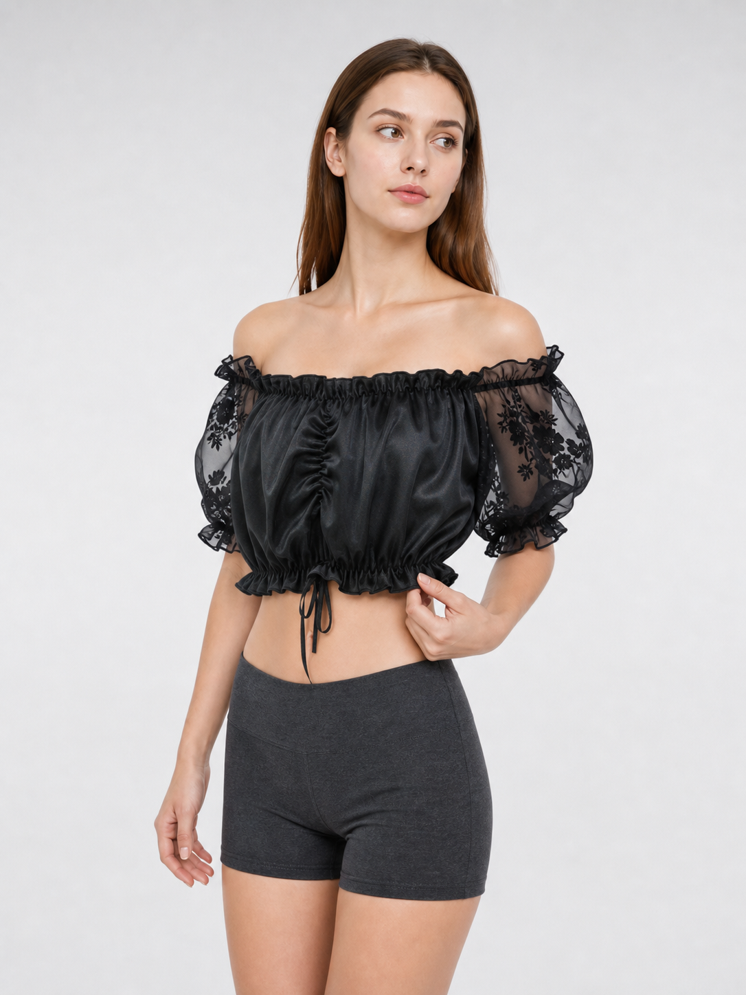 The blouse is black: the main body is made of opaque, smooth fabric