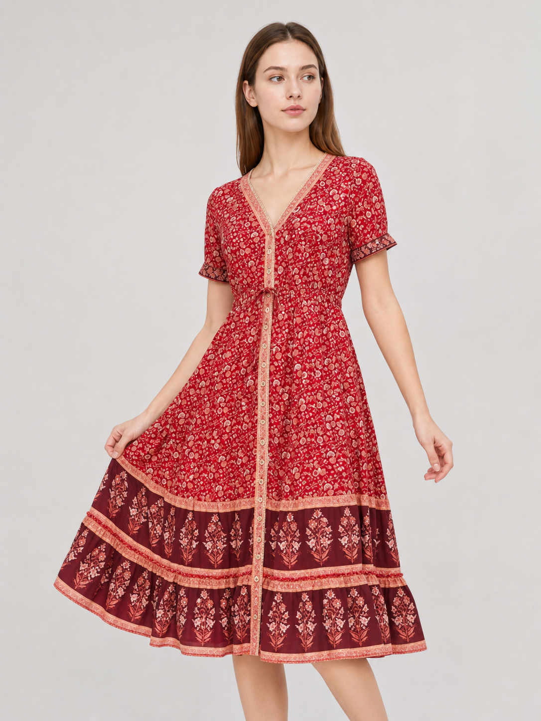 Midi dress with a floral print and tiered skirt