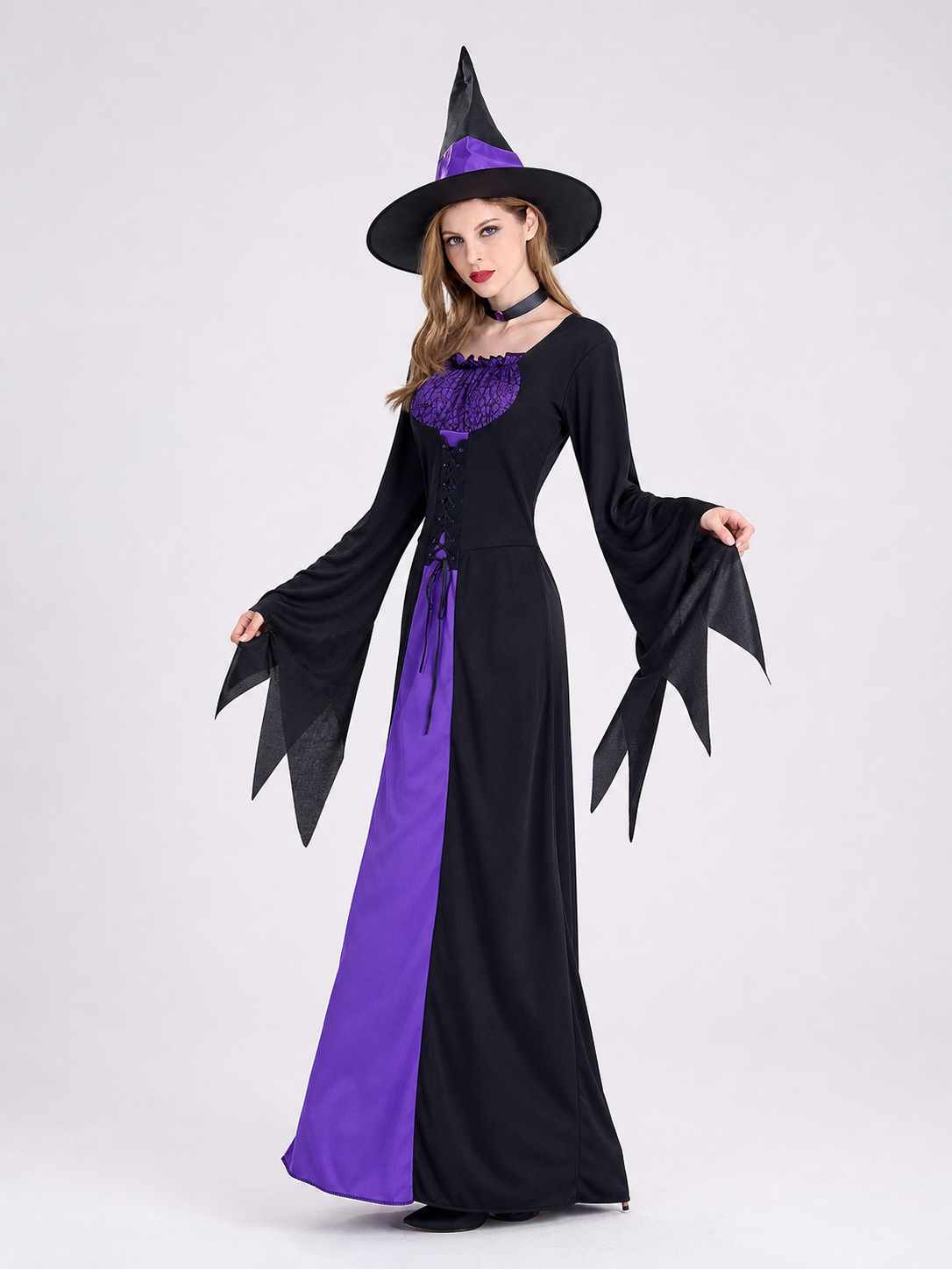 Cosplay costume designed as a long black and purple wizard-themed dress. The set includes a dress, a pointed wide-brimmed hat, and a collar. The design features long sleeves with flared cuffs, a fitted upper section, and a lace-up front. Th