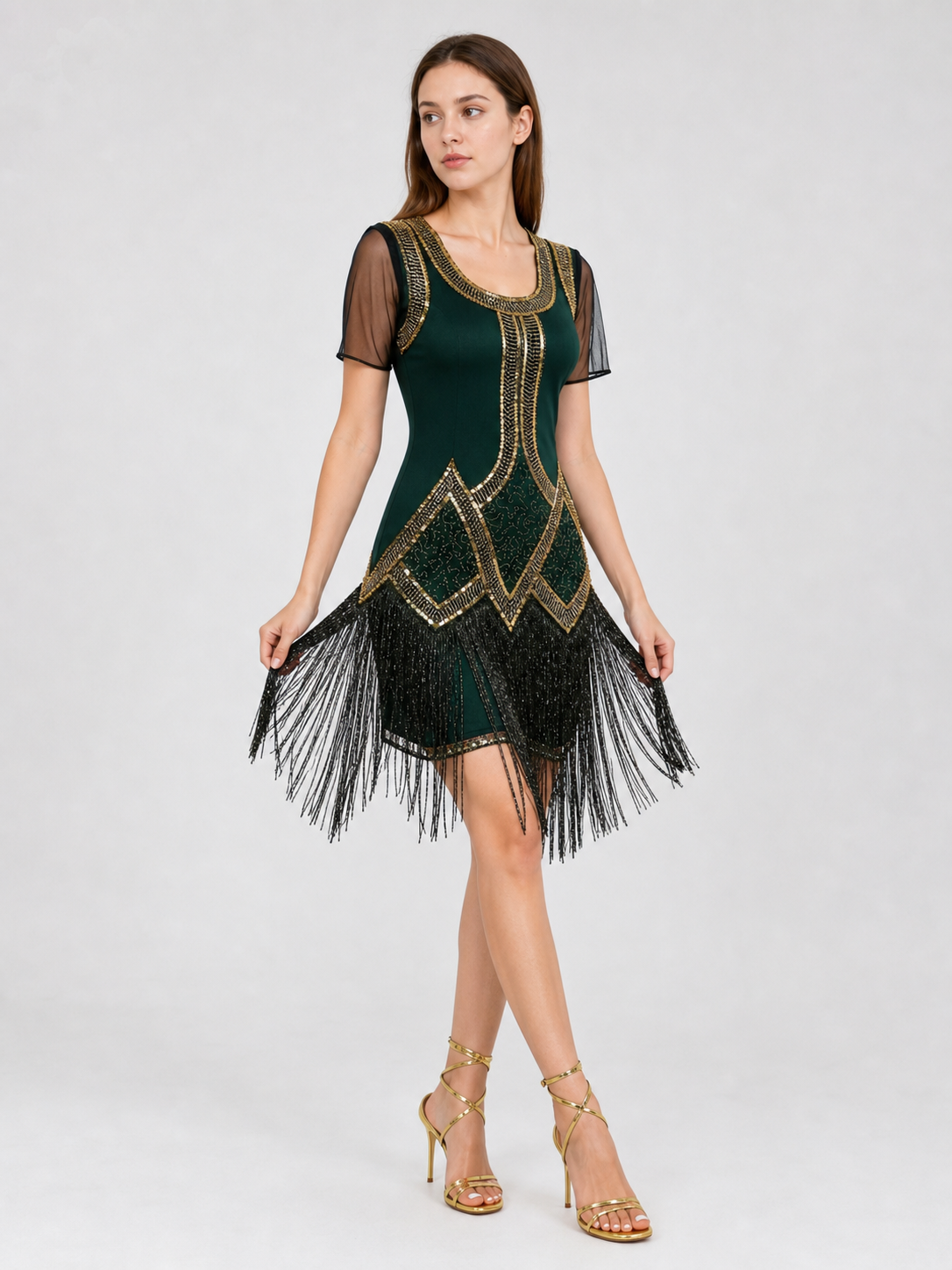 This fringed dress is designed in a vintage cocktail style, combining dark green
