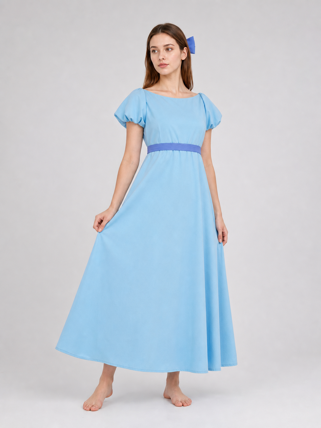 Peter Pan cosplay dress in light blue with contrasting purple-blue details. This style features a round neckline, short sleeves, and a long silhouette with a fitted upper body and a flared A-line skirt. The waist has contrasting ties that a