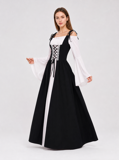 The dress is designed in a vintage medieval style and features characteristic elements of Renaissance-era clothing. The main part of the design is black, while the white details create a striking contrast. The fitted black bodice features a