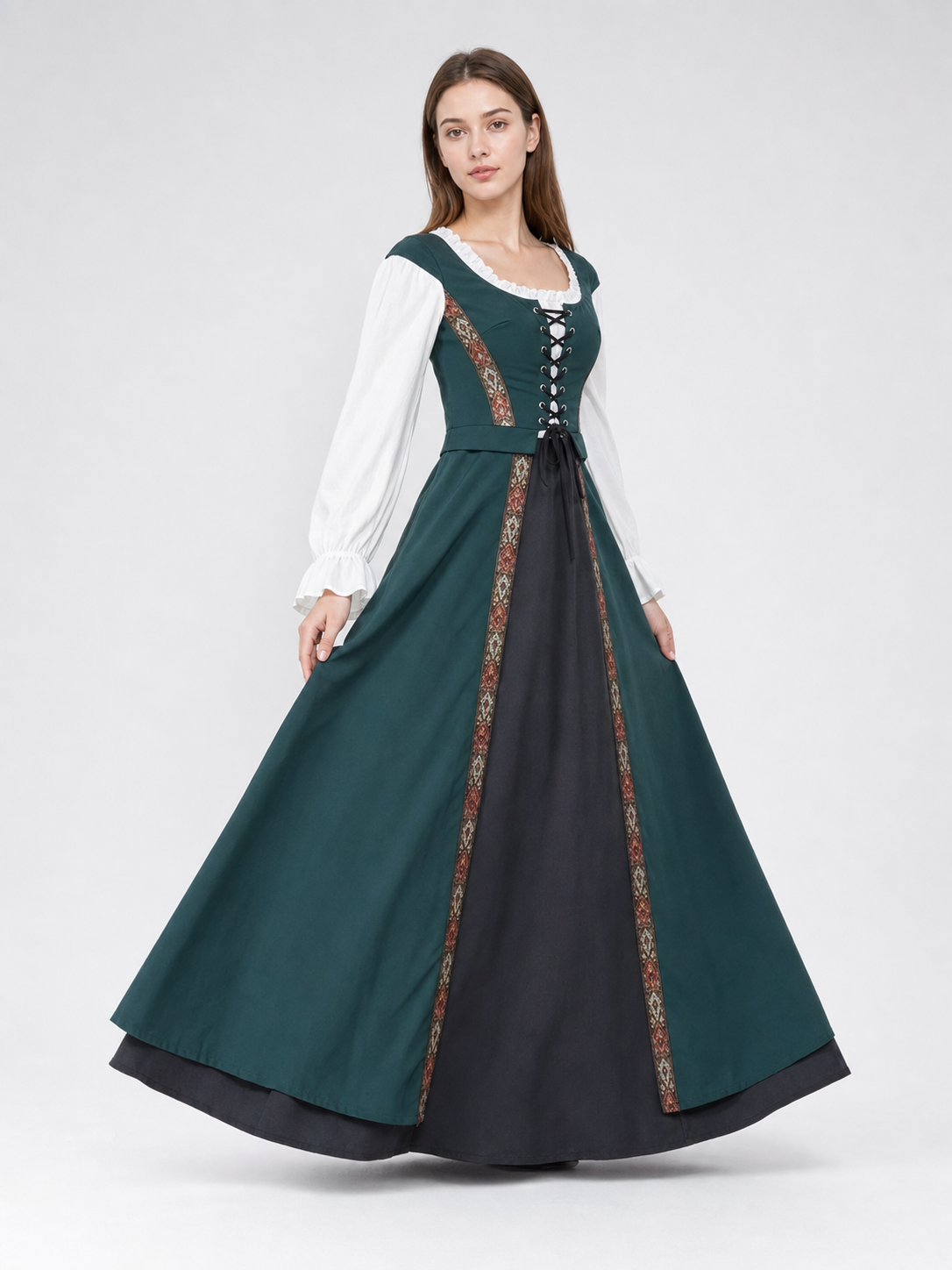 The retro dress is designed in a courtly style and comes with a woven headpiece. The dress is presented in deep green with long white sleeves, white trim along the edge of the collar and cuffs, and crisscross lacing at the front that emphas