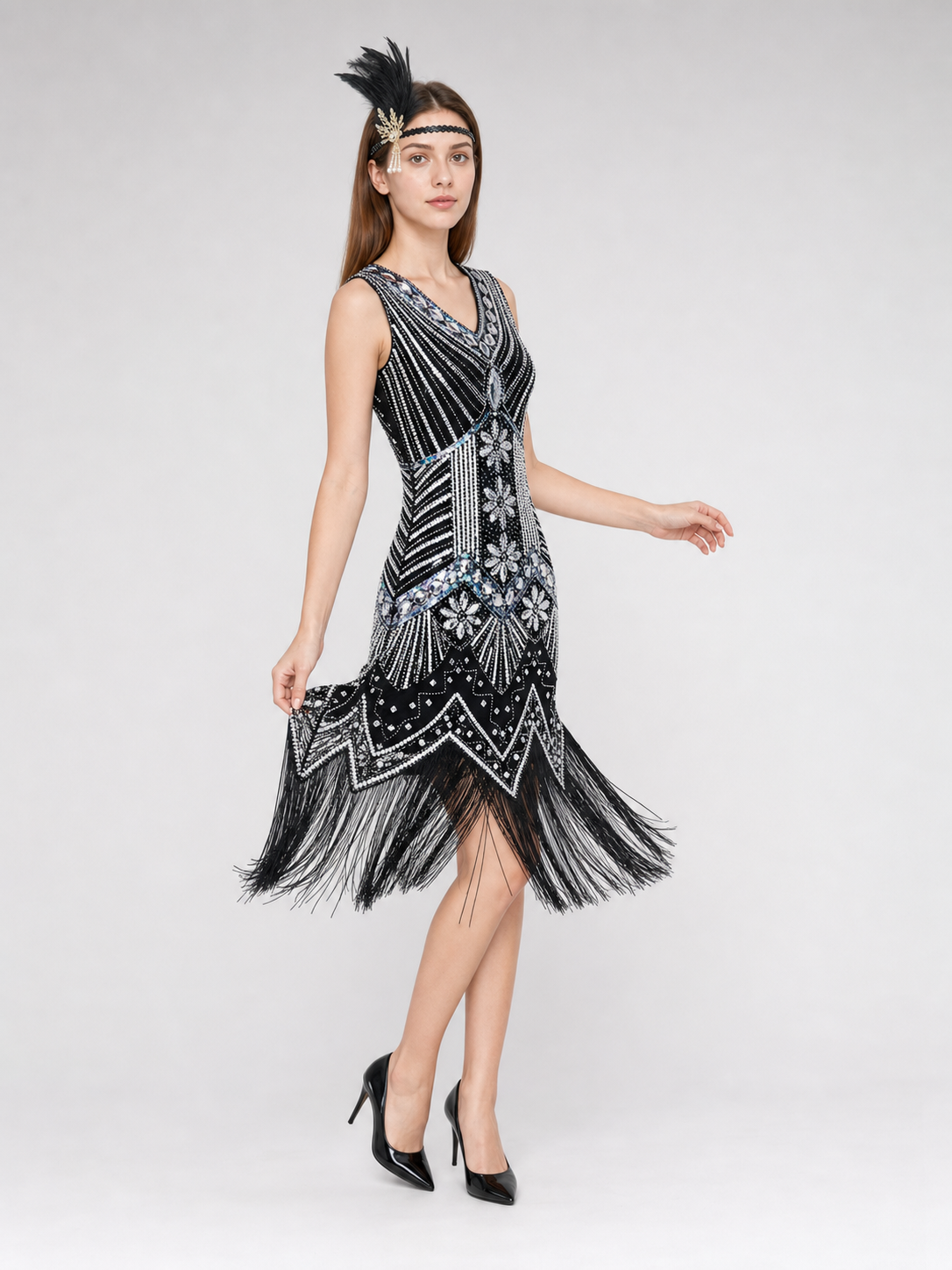 Sleeveless dress with a V-neckline and a fitted silhouette, made from fabric