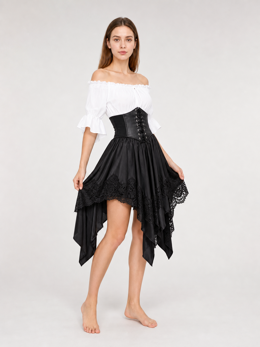 The set is designed in a theatrical pirate style and consists of a white cropped off-the-shoulder top with voluminous puff sleeves, a black corset with front lacing and metal eyelets, and a black asymmetrical skirt with elongated pointed pa