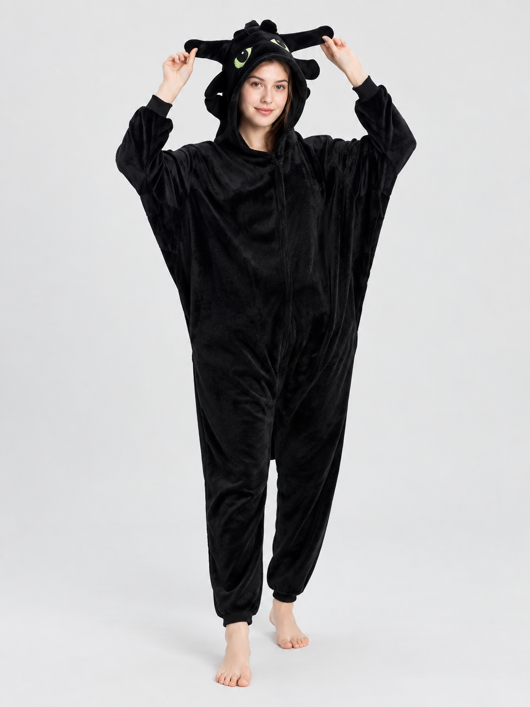 Black and white pajama jumpsuit with a hood and ears