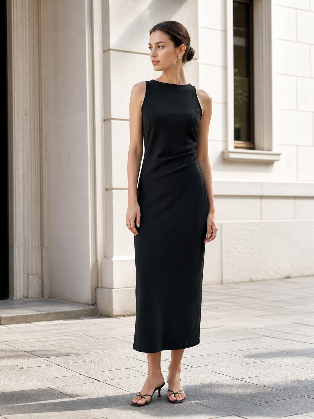 Black women's sleeveless midi dress with a high neckline