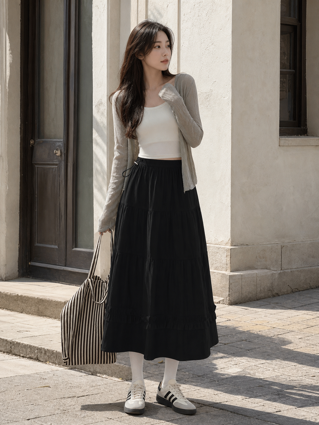 Long black A-line skirt with tiered pleats
