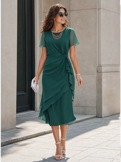 Green short-sleeve dress with an asymmetrical ruffle
