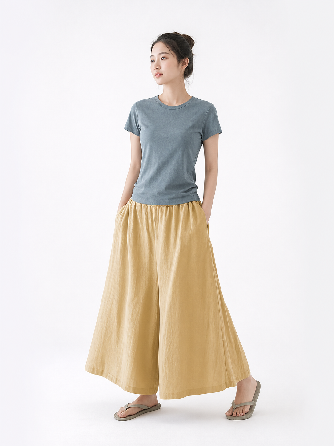 Beige palazzo pants with a loose fit and pockets