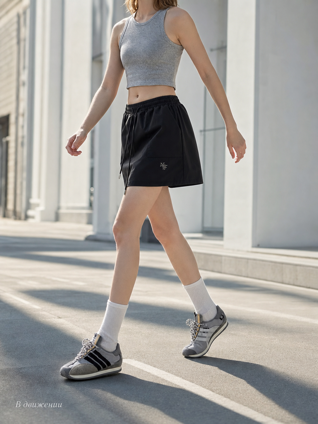 Loose-fit women's shorts with an elastic waistband and drawstring. The design features a minimalist style and a noticeable detail at the front—a drawstring for adjustment. The elastic waistband helps maintain a neat fit, while the loose cut