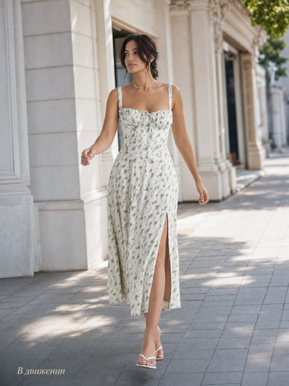 Lightweight midi dress with thin straps, floral print, slit, and fitted silhouette