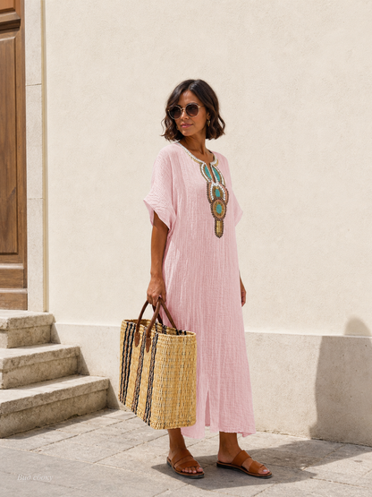 Pink loose-fit midi dress with embroidery and a slit