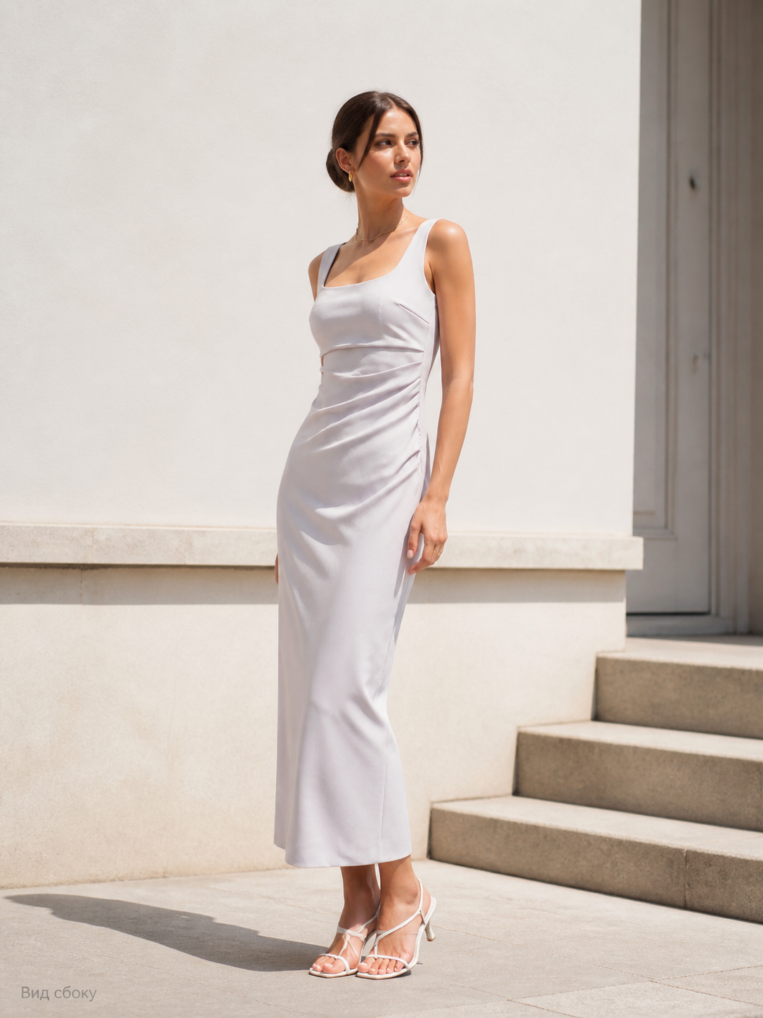 Women's fitted midi dress with thin straps and draping