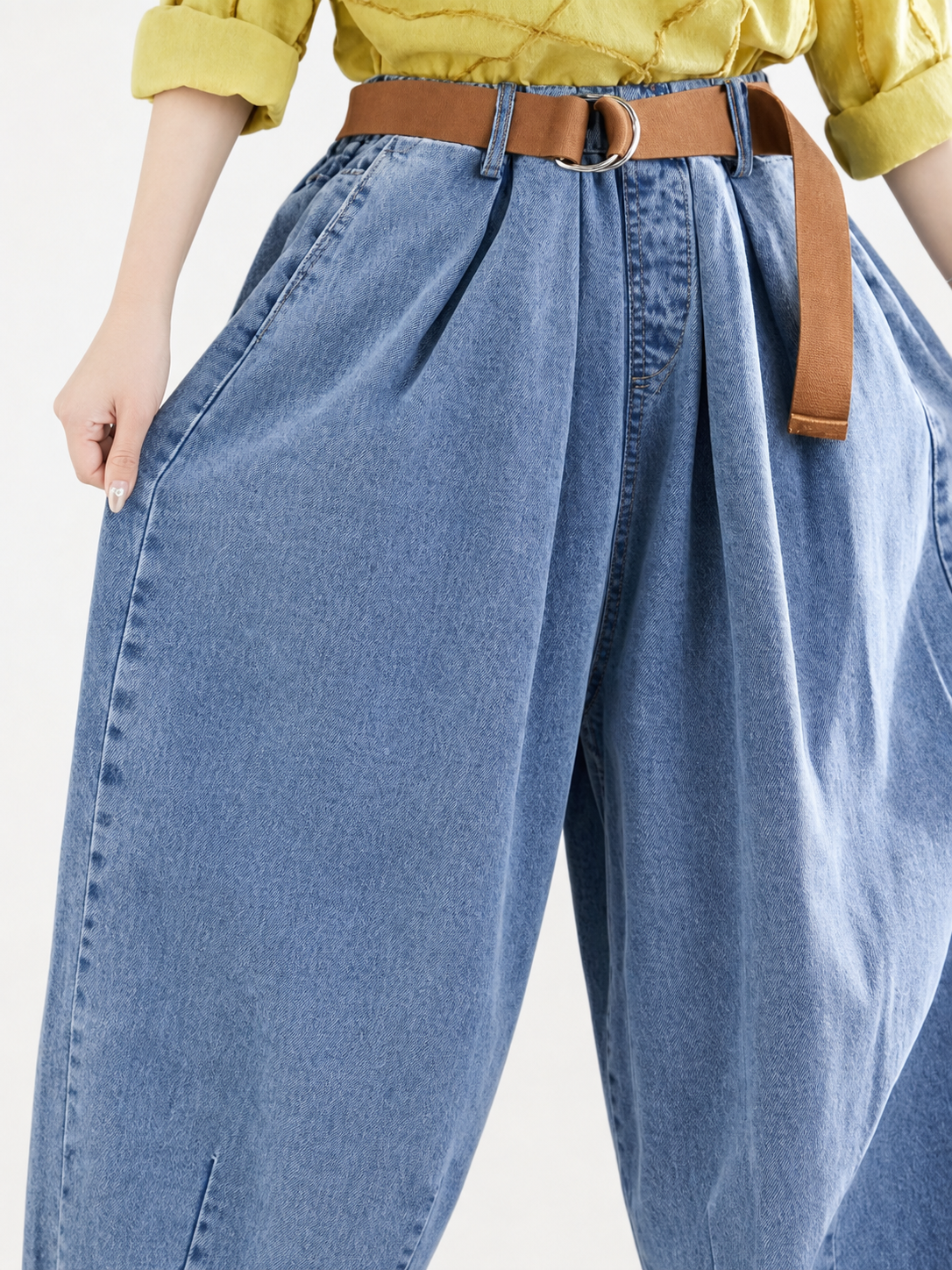 Wide-leg harem pants with a high rise and belt