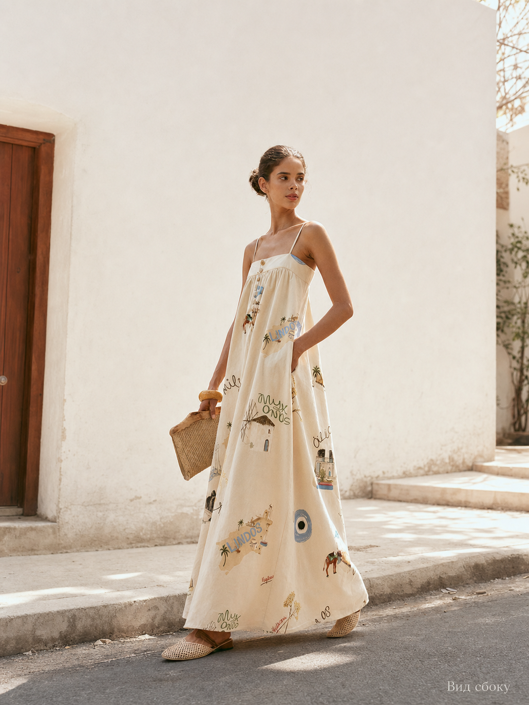 Long dress with thin straps, a print, and buttons