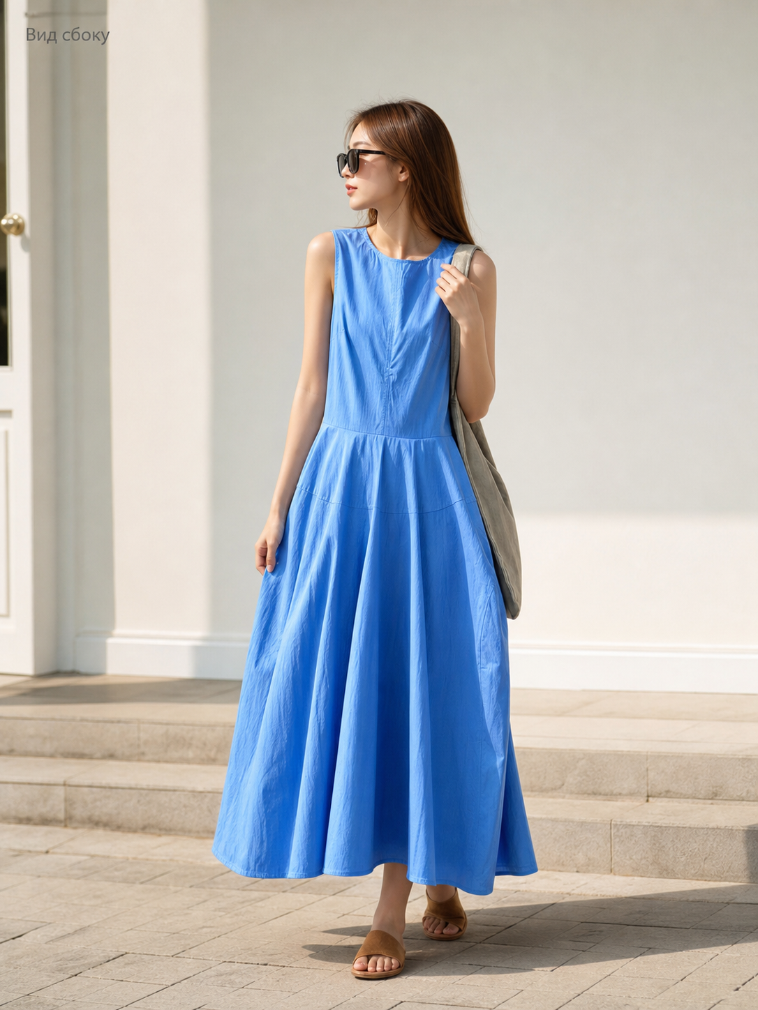 Women's blue sleeveless midi dress with pockets
