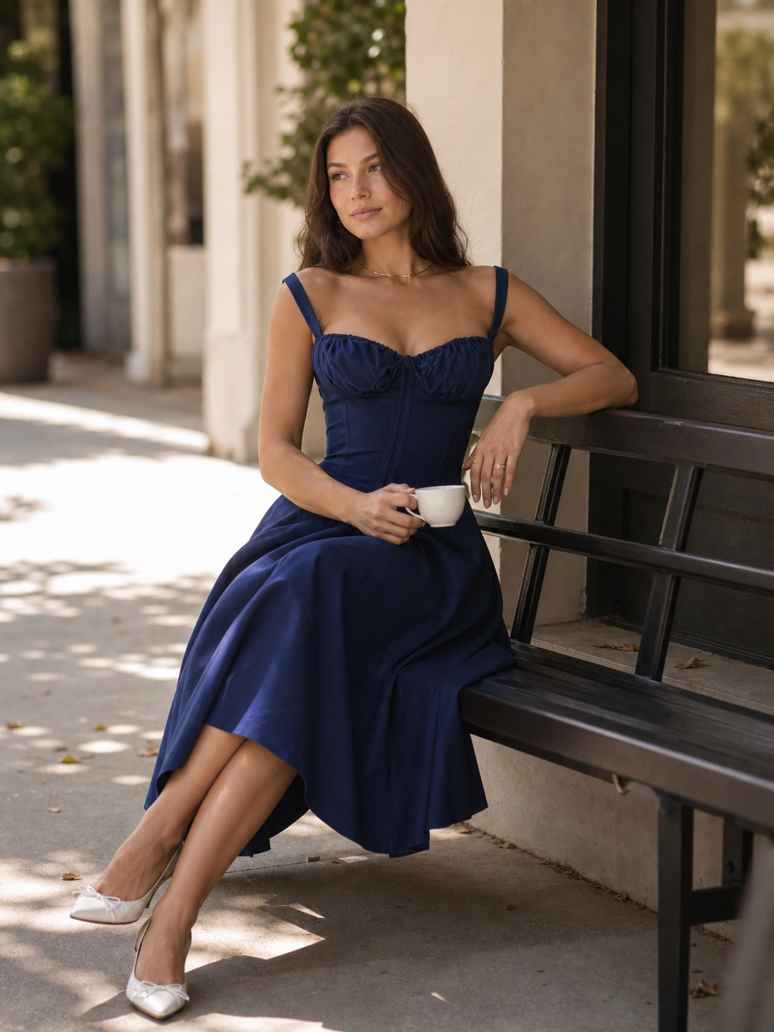 Women’s dark navy dress with spaghetti straps and a corset bodice