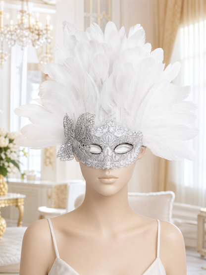 White feather and silver filigree masquerade mask shown front-facing on a mannequin in an indoor setting
