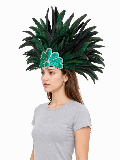 Green and black feather carnival headpiece shown in side profile on a model wearing a gray shirt, with layered plumes