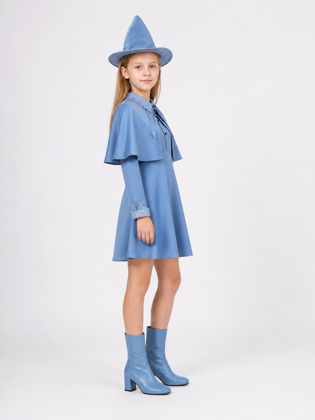 Blue witch costume side view showing short cape and flared skirt