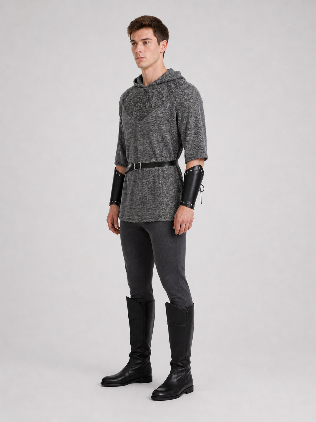 The costume is designed in the style of a medieval knight and is suitable for cosplay and stage performances. The set includes a gray hooded top with a layered front design, black pants, a belt, bracers, and greaves. The gray-and-black colo