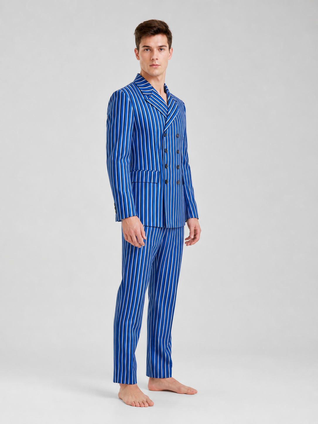 The Doctor Who cosplay double-breasted suit is designed in a white-and-blue color scheme with vertical stripes. The set includes a jacket and pants made in the same design. The jacket features a double-breasted closure, peaked lapels, and f