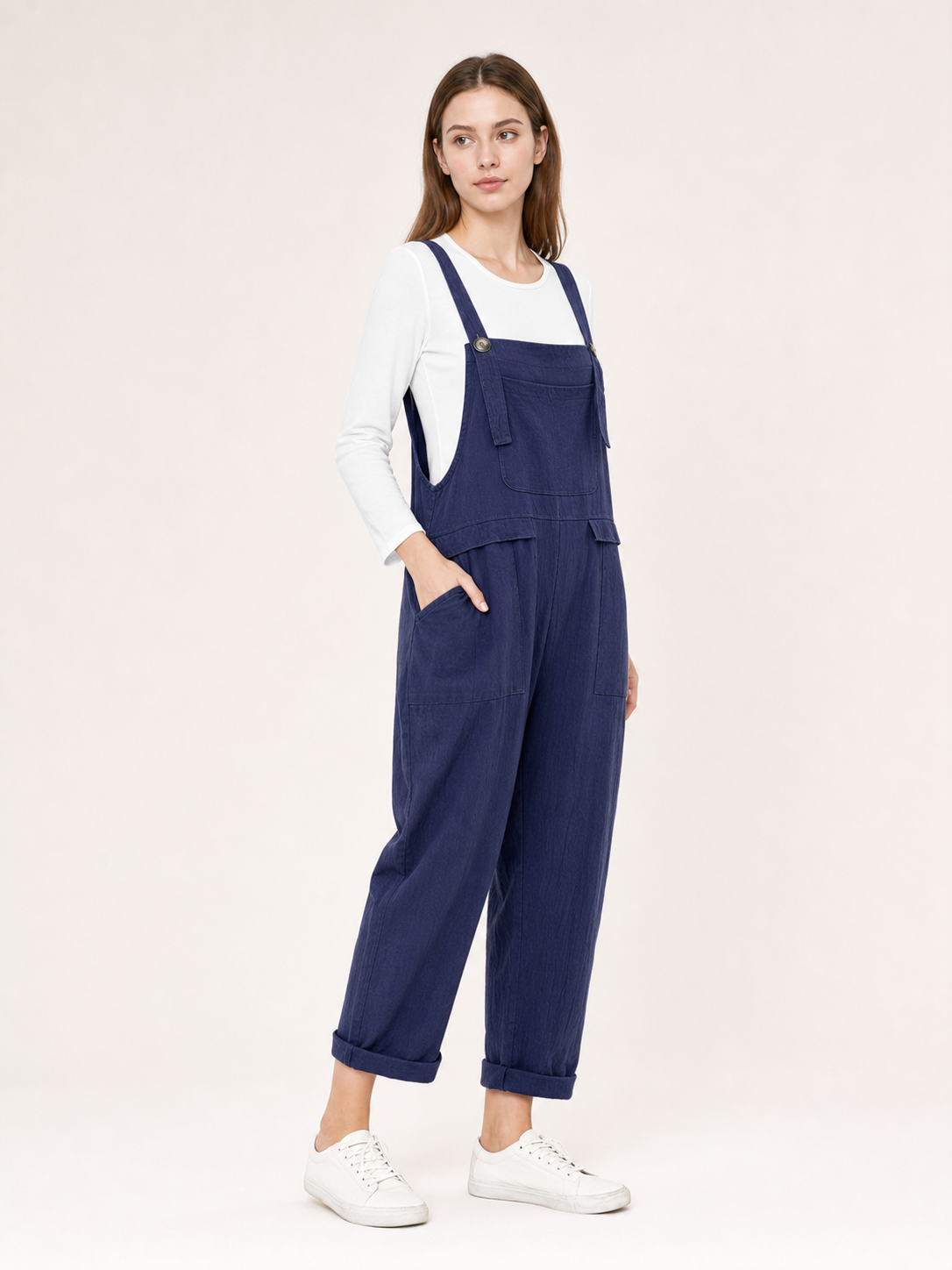 Loose-fit dark navy bib overalls with straps and pockets