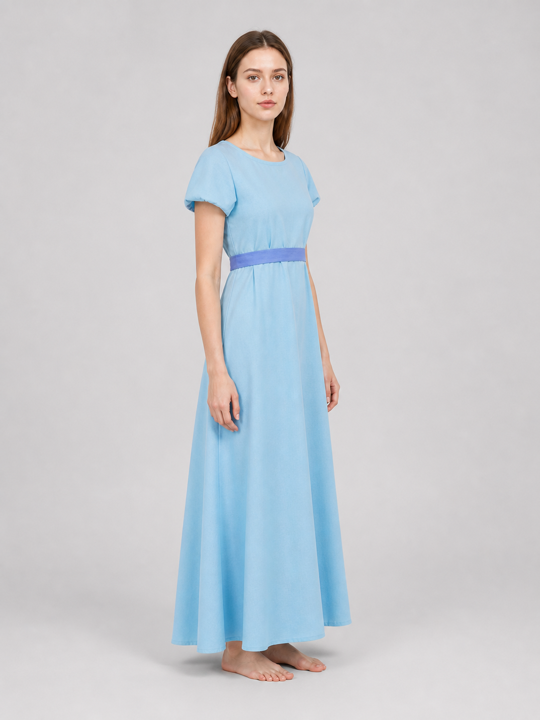 Peter Pan cosplay dress in light blue with contrasting purple-blue details. This style features a round neckline, short sleeves, and a long silhouette with a fitted upper body and a flared A-line skirt. The waist has contrasting ties that a
