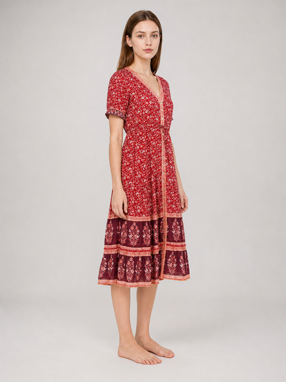 Midi dress with a floral print and tiered skirt