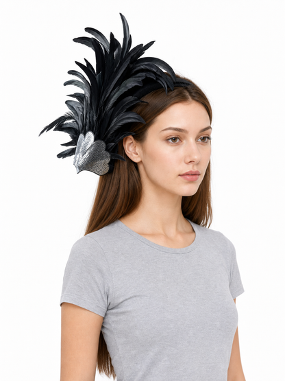 Feather carnival accessory with a silver heart