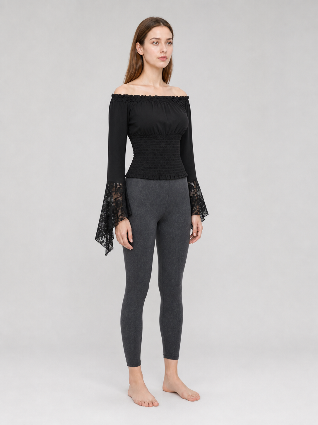 Black off-the-shoulder blouse with ruffles and long sleeves