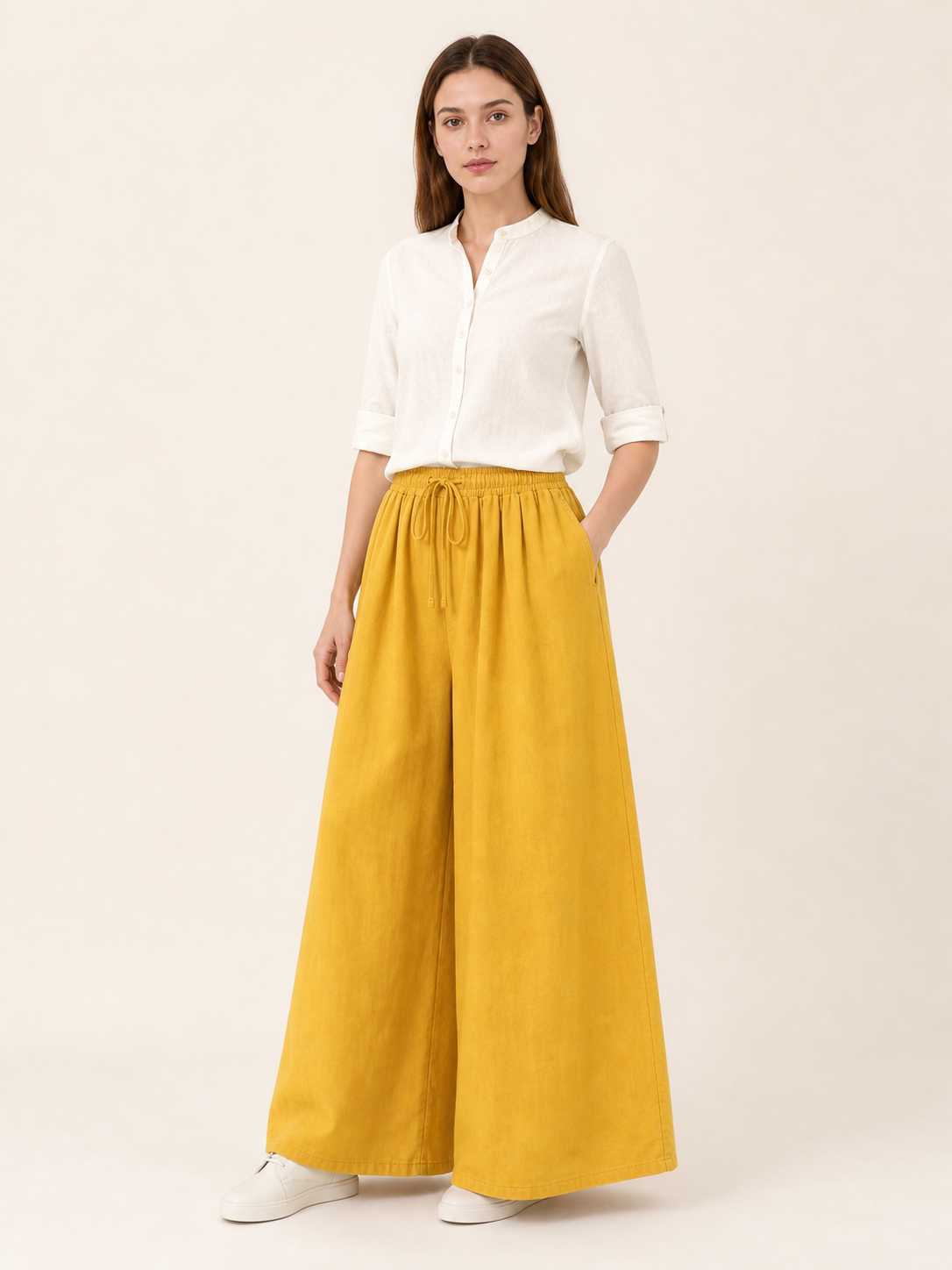 Mustard-colored wide-leg pants with long pant legs