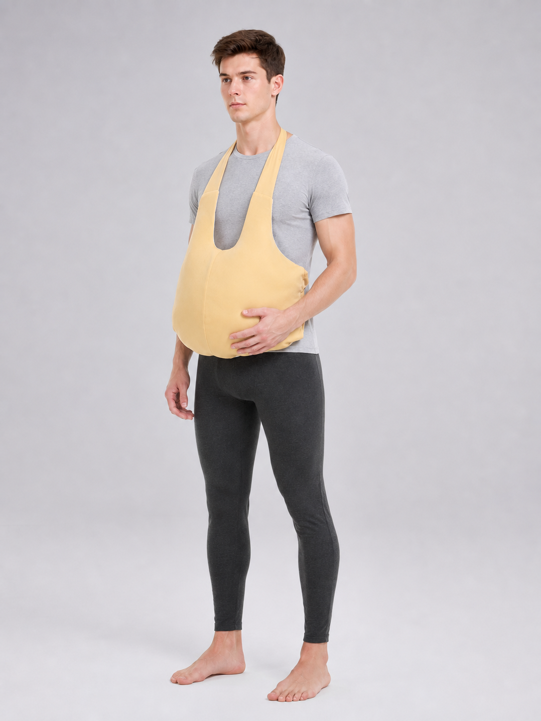 The fake belly is designed as a costume accessory with a large, rounded shape.