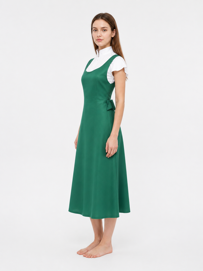 Long green pinafore dress with pockets side view
