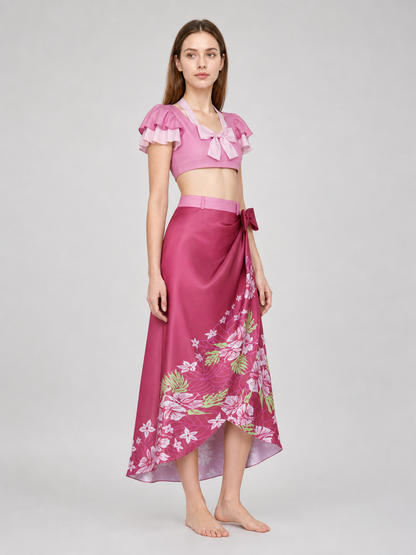 This cosplay set is designed as a short-sleeve crop top and a long skirt. It includes a top, a half-skirt, and decorative bows. There is a bow on the chest of the top, and another bow is placed on the side of the skirt waist. The top has an