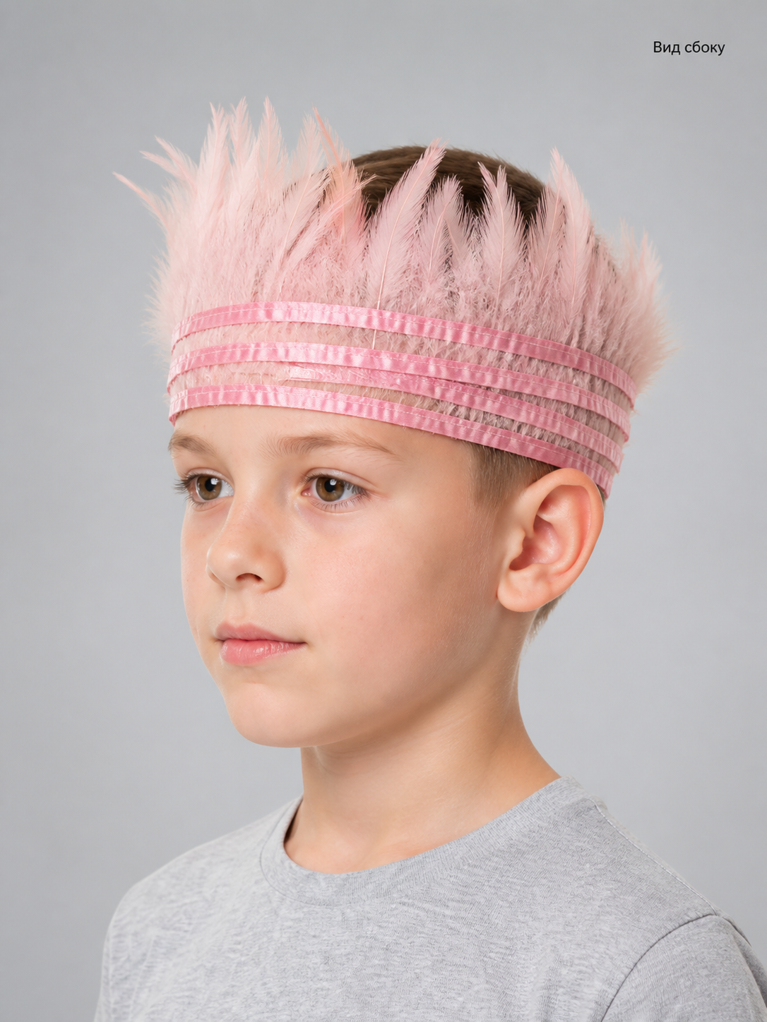 Pink feather headpiece with multiple pink bands, shown in a close-up side view on a child