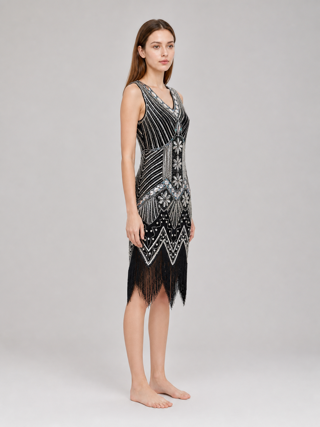 Sleeveless dress with a V-neckline and a fitted silhouette, made from fabric