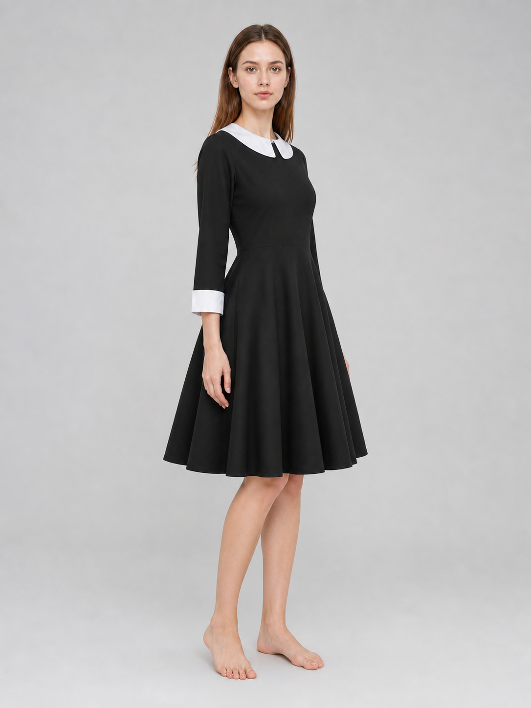 Black Wednesday-style dress with a white collar side view 2