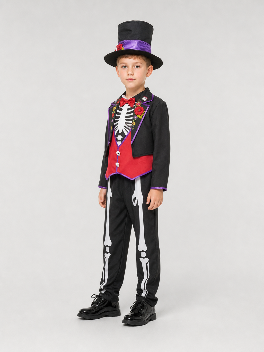 This skeleton costume is designed in the Mexican style of the Day of the Dead celebration. The outfit includes a black jacket with purple trim and floral decorations, a red vest-style front panel with decorative buttons, a red bow tie, blac