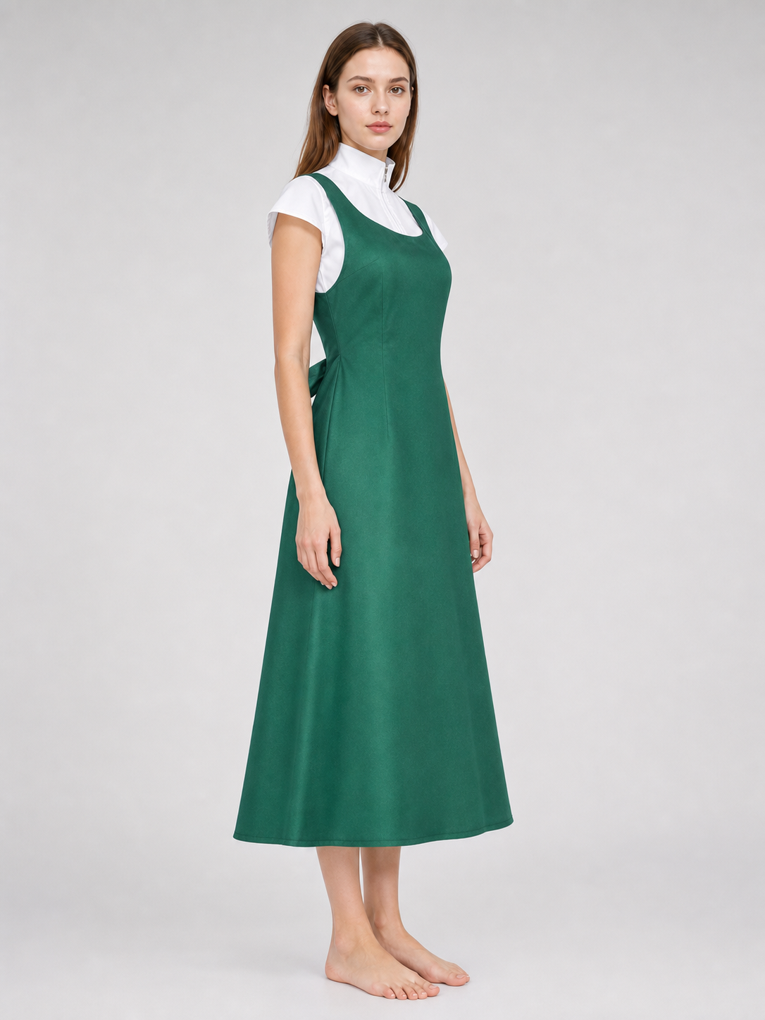 The green Kushina Uzumaki cosplay pinafore dress is designed in the recognizable style of the character from the anime Naruto: Shippuden. The design is a green pinafore dress with a square neckline, wide straps, and open pockets on the side