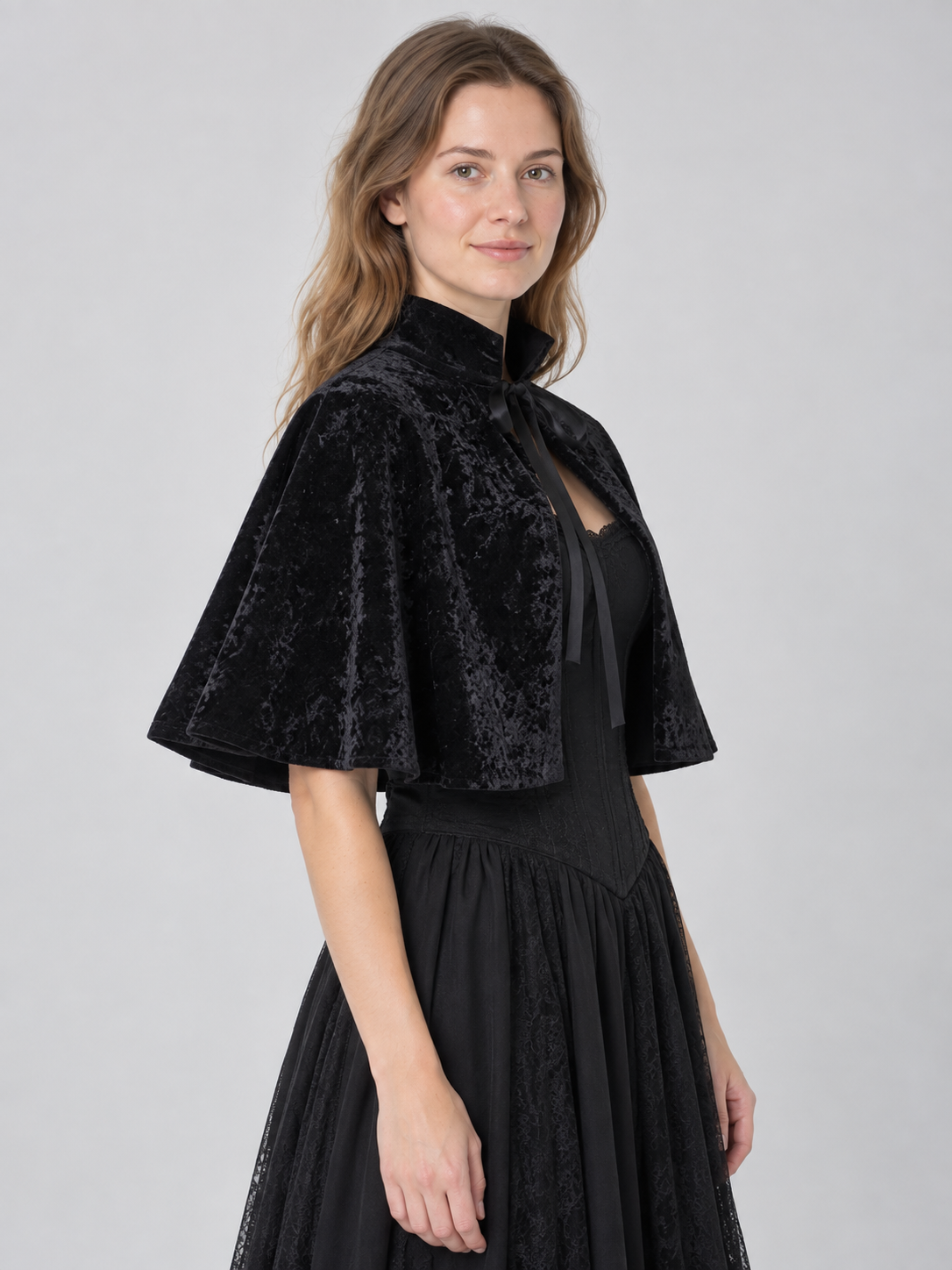 Black velvet cape with high collar and ties