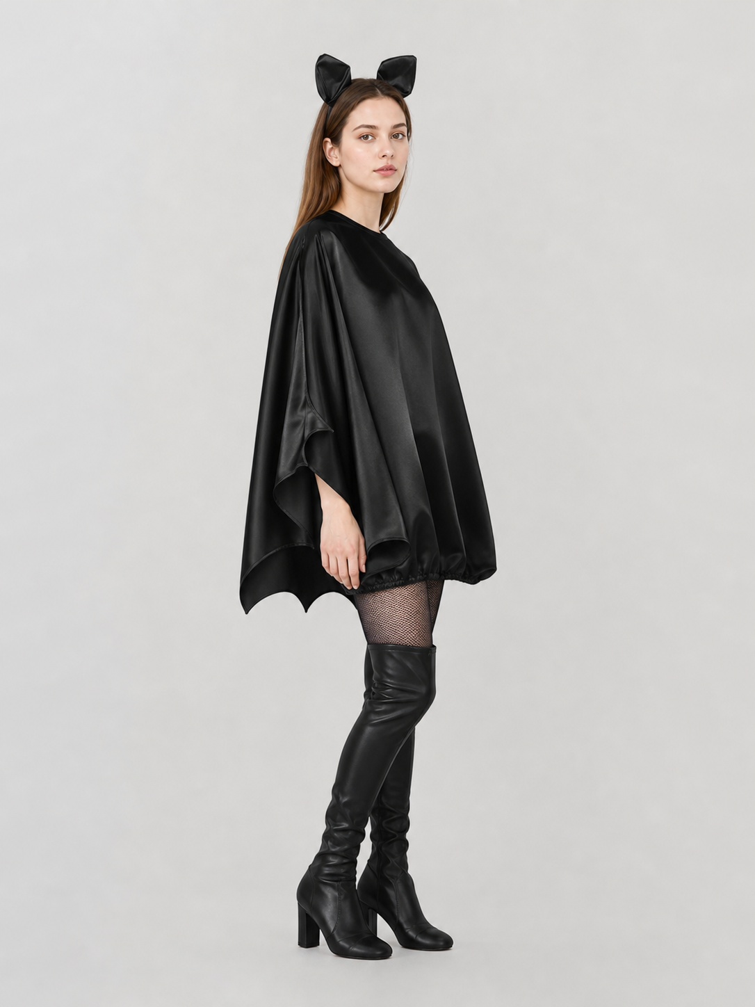 Black bat costume dress with a headband and ears for themed events. The design side view