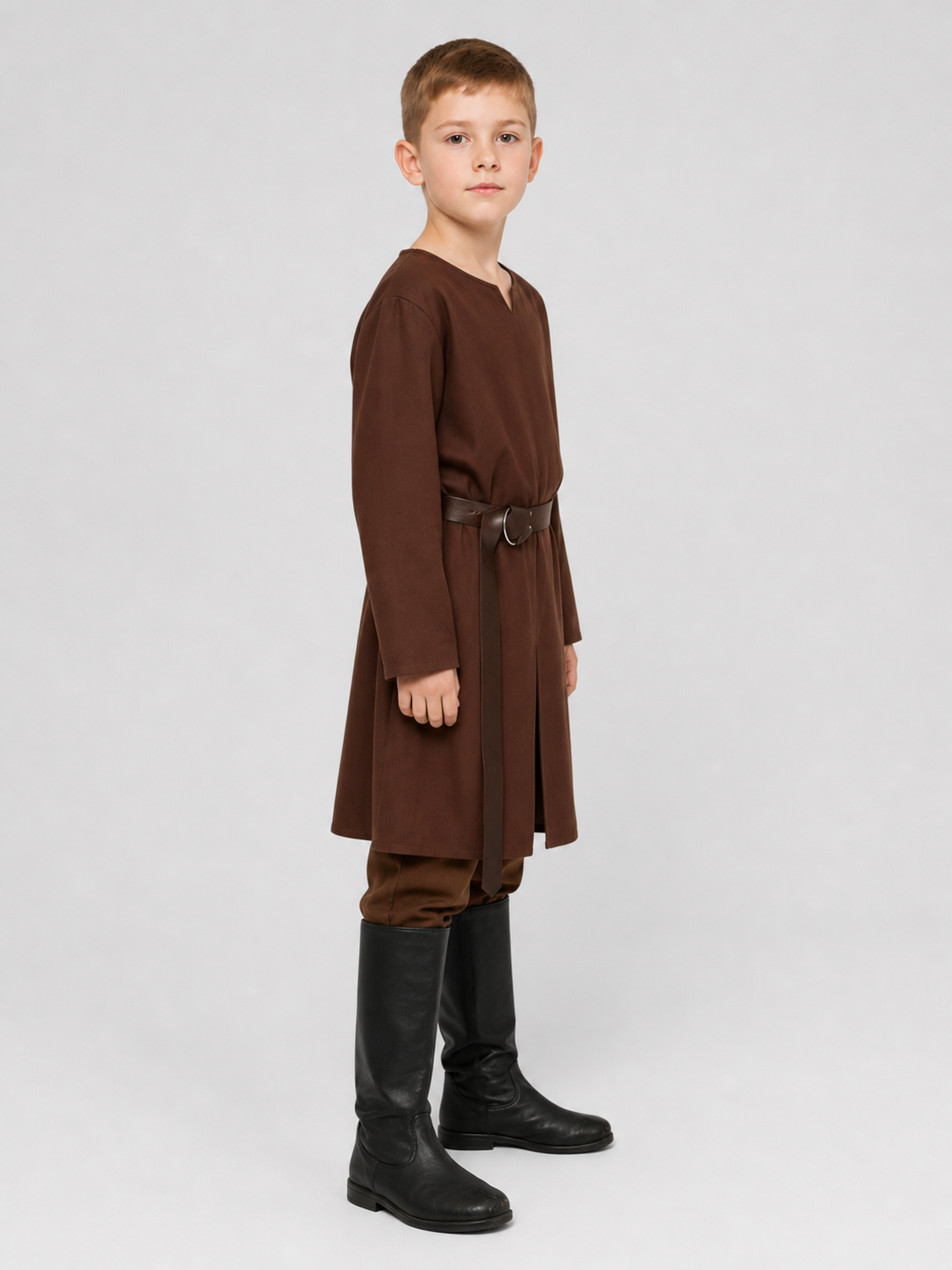 Side profile of a child wearing a brown belted tunic, matching pants, and tall black boots