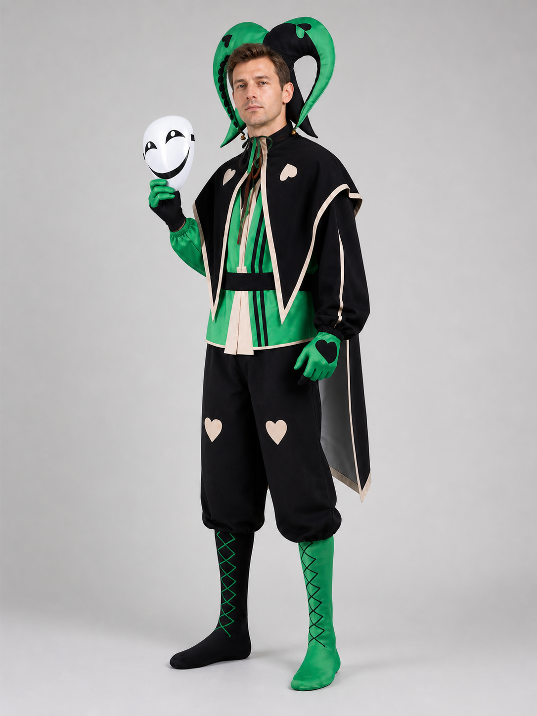 Side view of the black and green jester clown costume showing the long black cape with cream trim